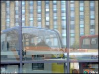 Bus reflected in windows of New Exeter Bus Station GX7 P1140646.JPG