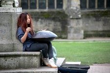 Girl with musical wok in Exeter Cathedral Close IMG_3449.JPG