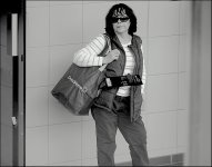 Woman waiting at bus station Exeter 100-400 G9 P1014568.jpeg