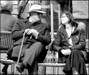 Man and woman on bench High Street Exeter G9 P1012190.JPG